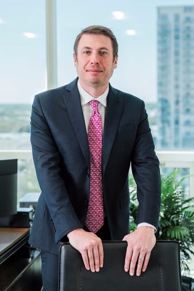 Professional man in suit, pink tie
