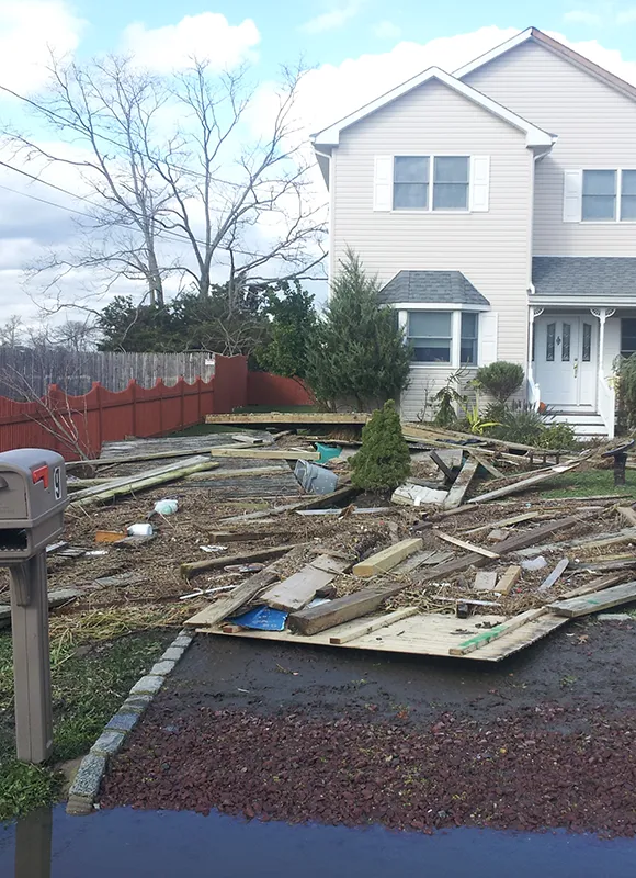 Storm debris scattered across residential yardRetry