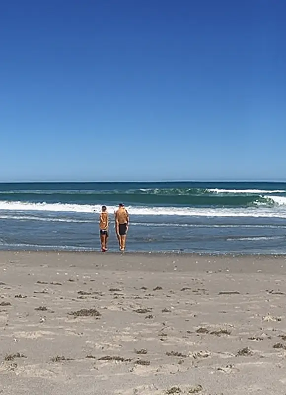 people walking in the beach